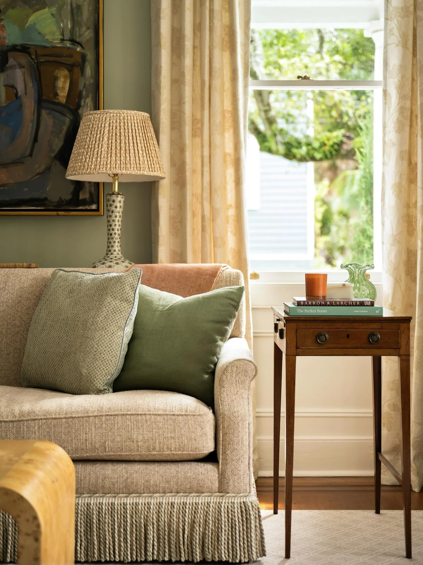 Southern spaces have a way of feeling collected over time especially in our client's historic Charleston home. We loved being able to honor what a client already loves so we refreshed this sofa with new @cowtanandtout fabric and added a tailored skir