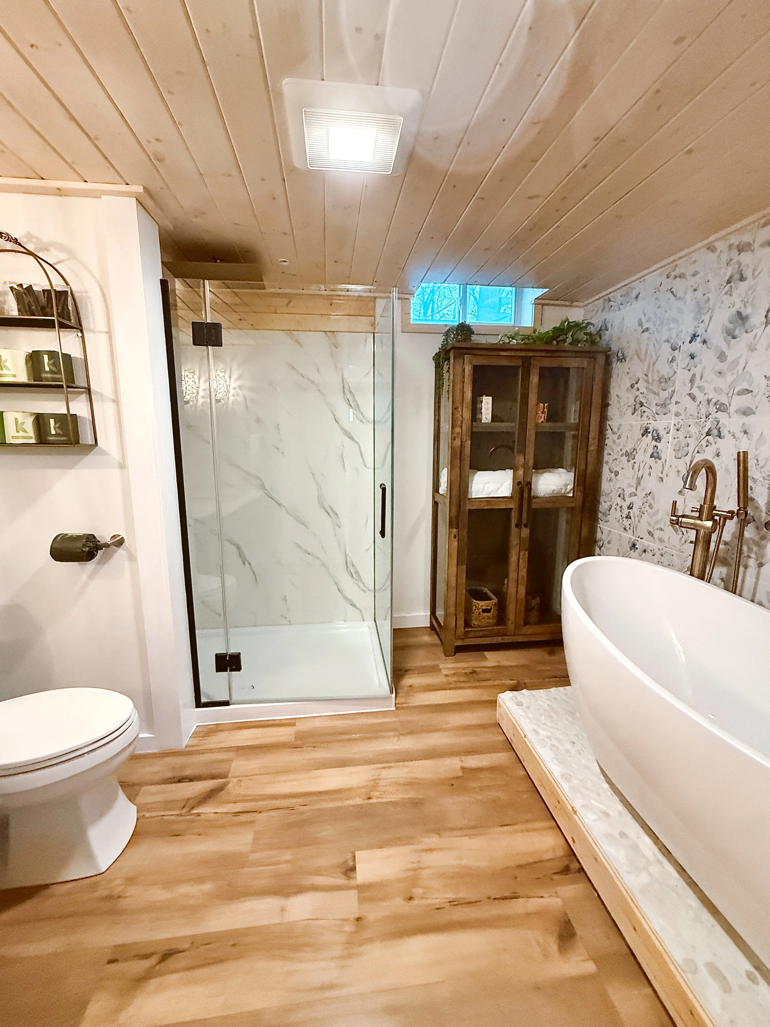 large hot tub on deck with privacy screen