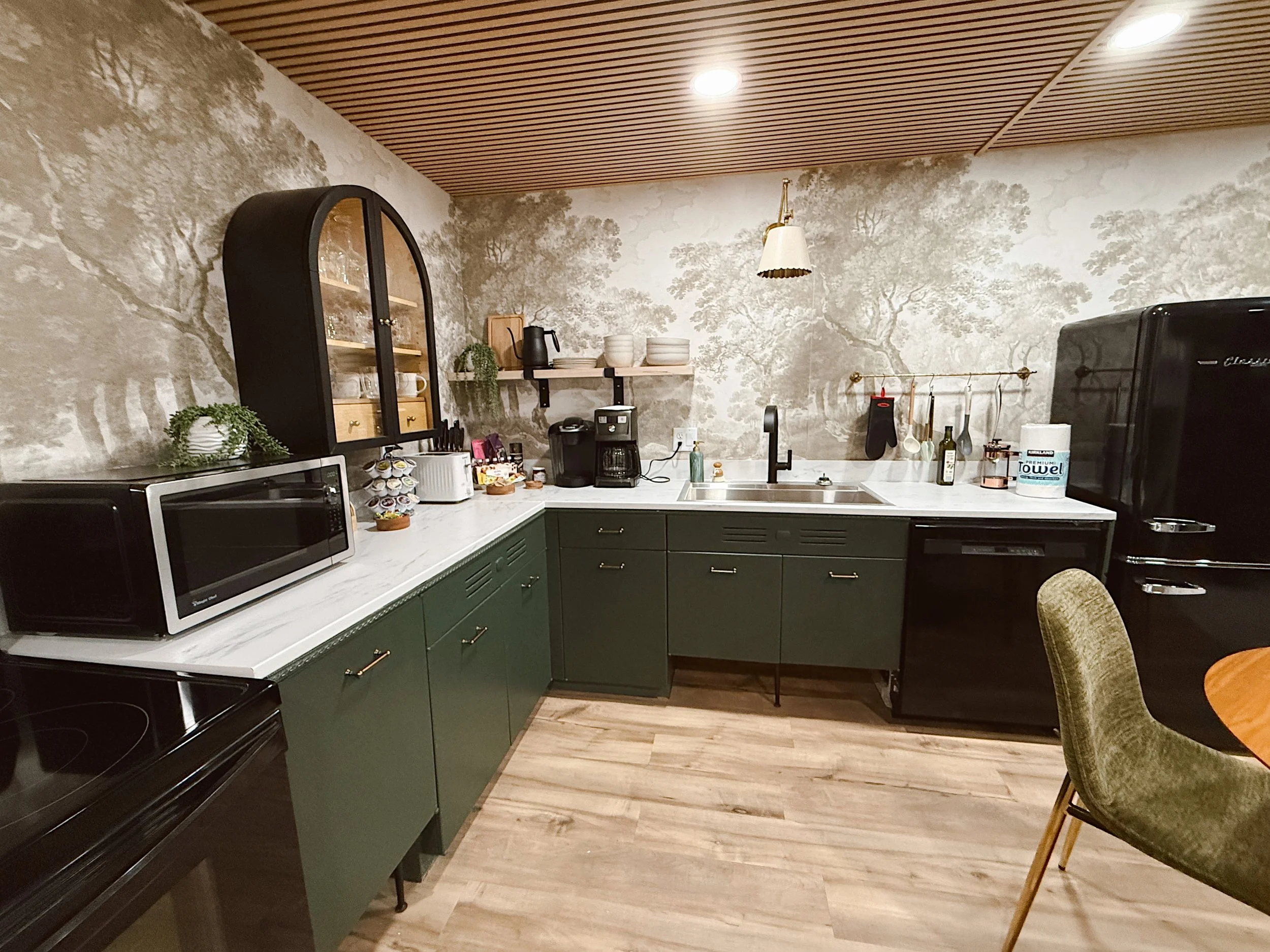 modern woodland kitchen with green cabinets
