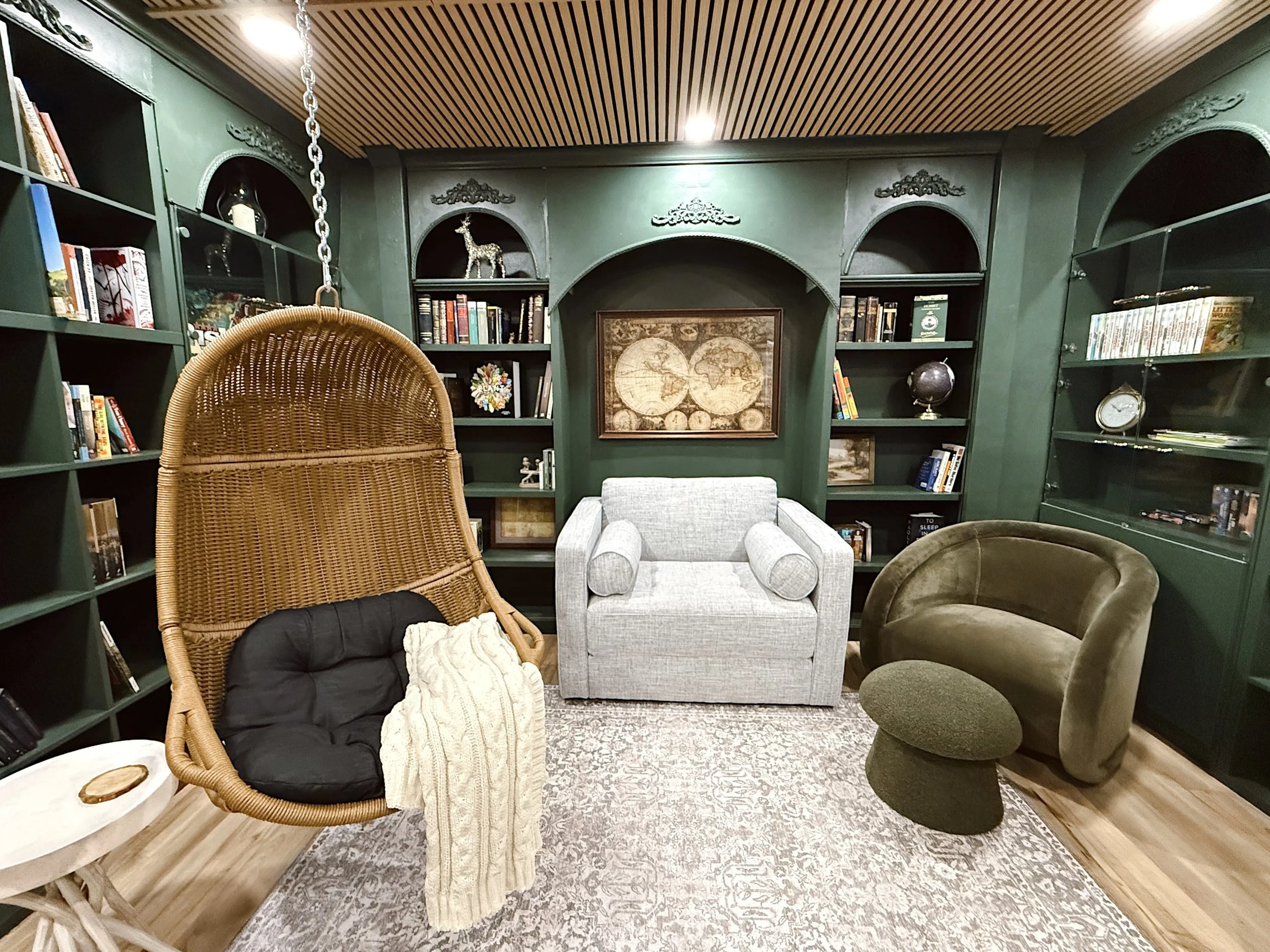Library Room with built in bookshelves and swing chair