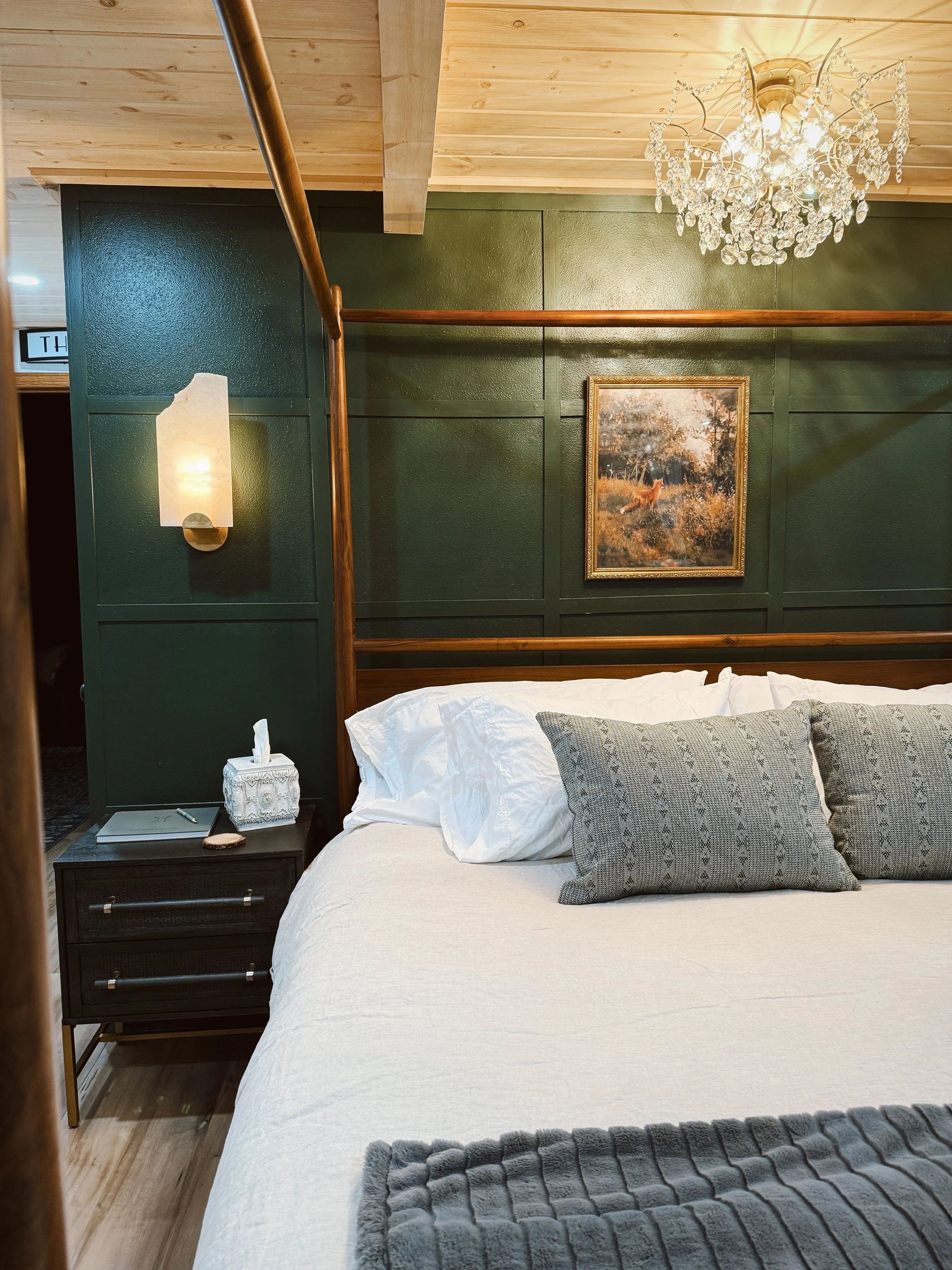 close up of king sized bed with luxury linens and fox photo