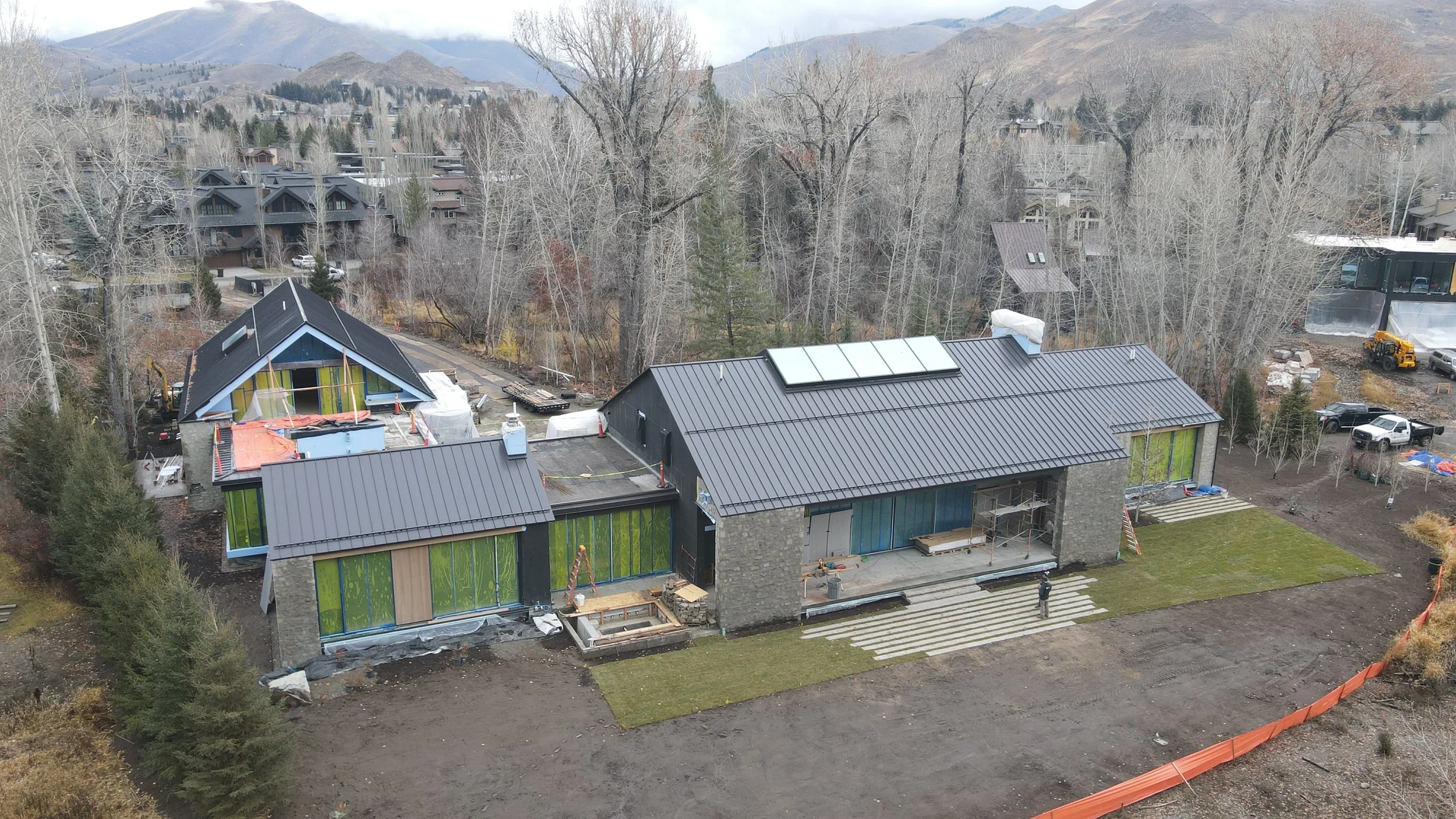 Arial shot of custom home exterior and back yard glass windows and skylight Ketchum Idaho
