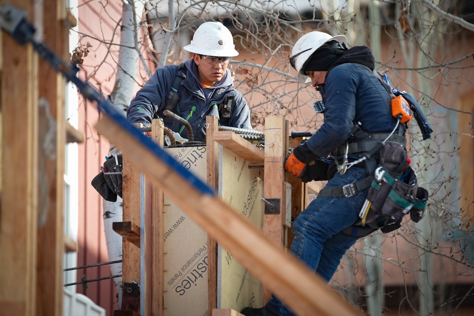 Workers install framing at Bluebird Village commercial construction Ketchum Idaho project