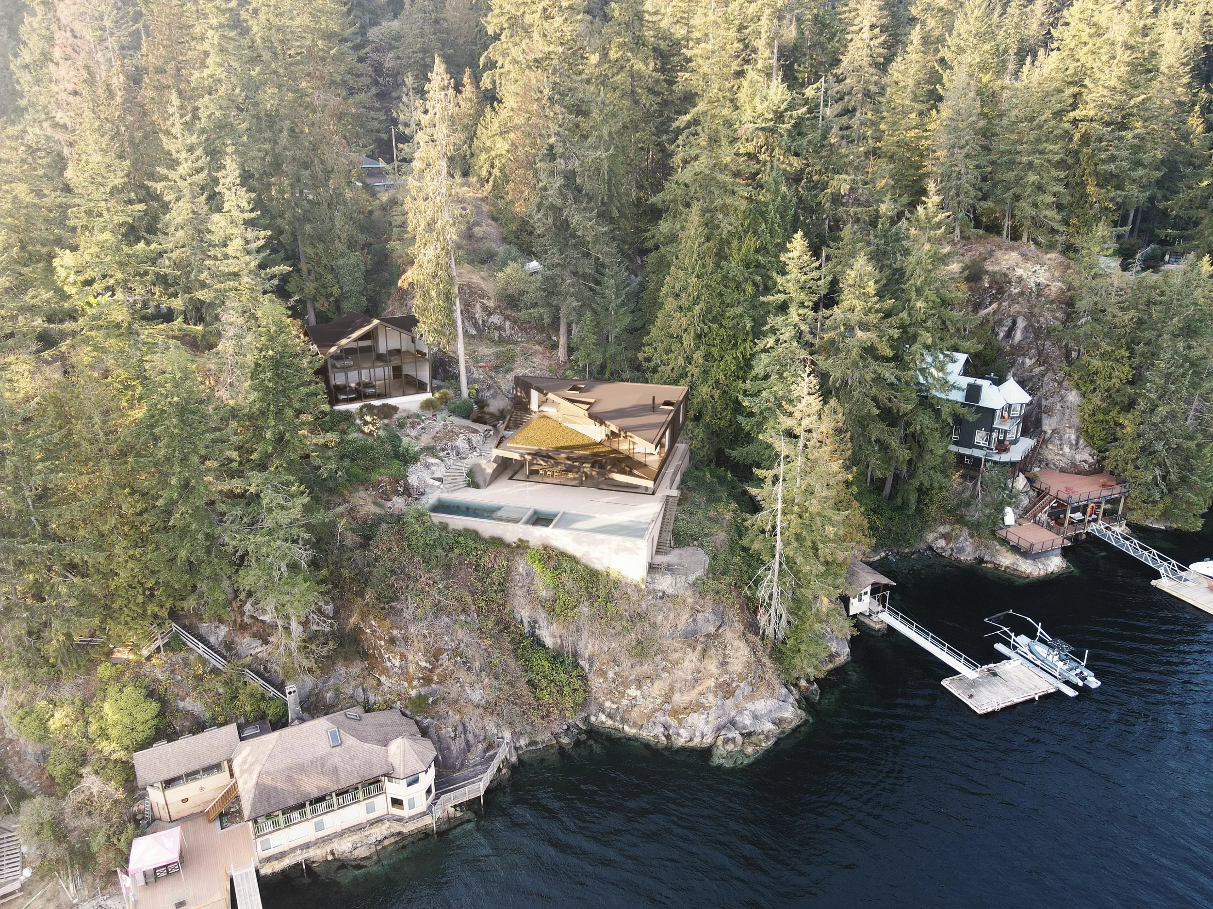 Aerial view of waterfront houses among dense evergreen trees on a rocky hillside by a lake, some with private docks and boats.
