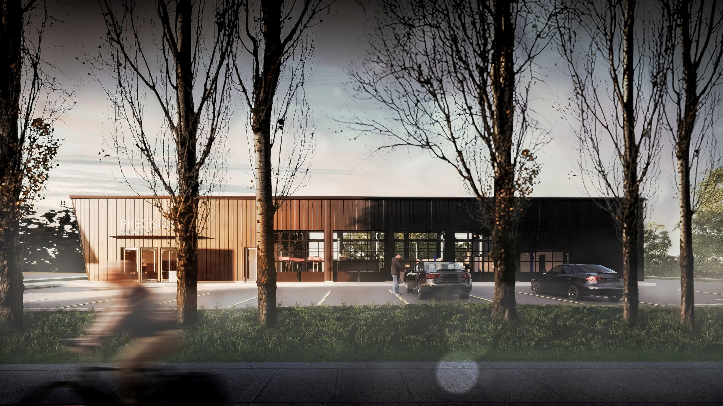 A modern building with glass and wood exterior, with a parking lot in front containing two cars and a person standing next to one of the cars, seen through a window with trees on the foreground and a blurred cyclist passing by.