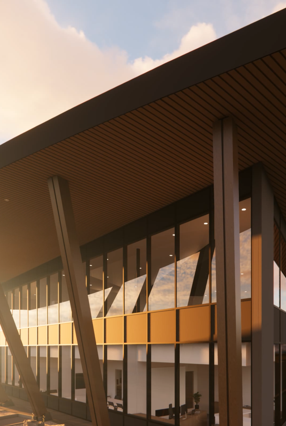 Close-up of Pan Pacific Pet modern commercial building in Mission BC designed by X Architecture. Warm wood soffit, large glass windows, and striking architectural details at golden hour.