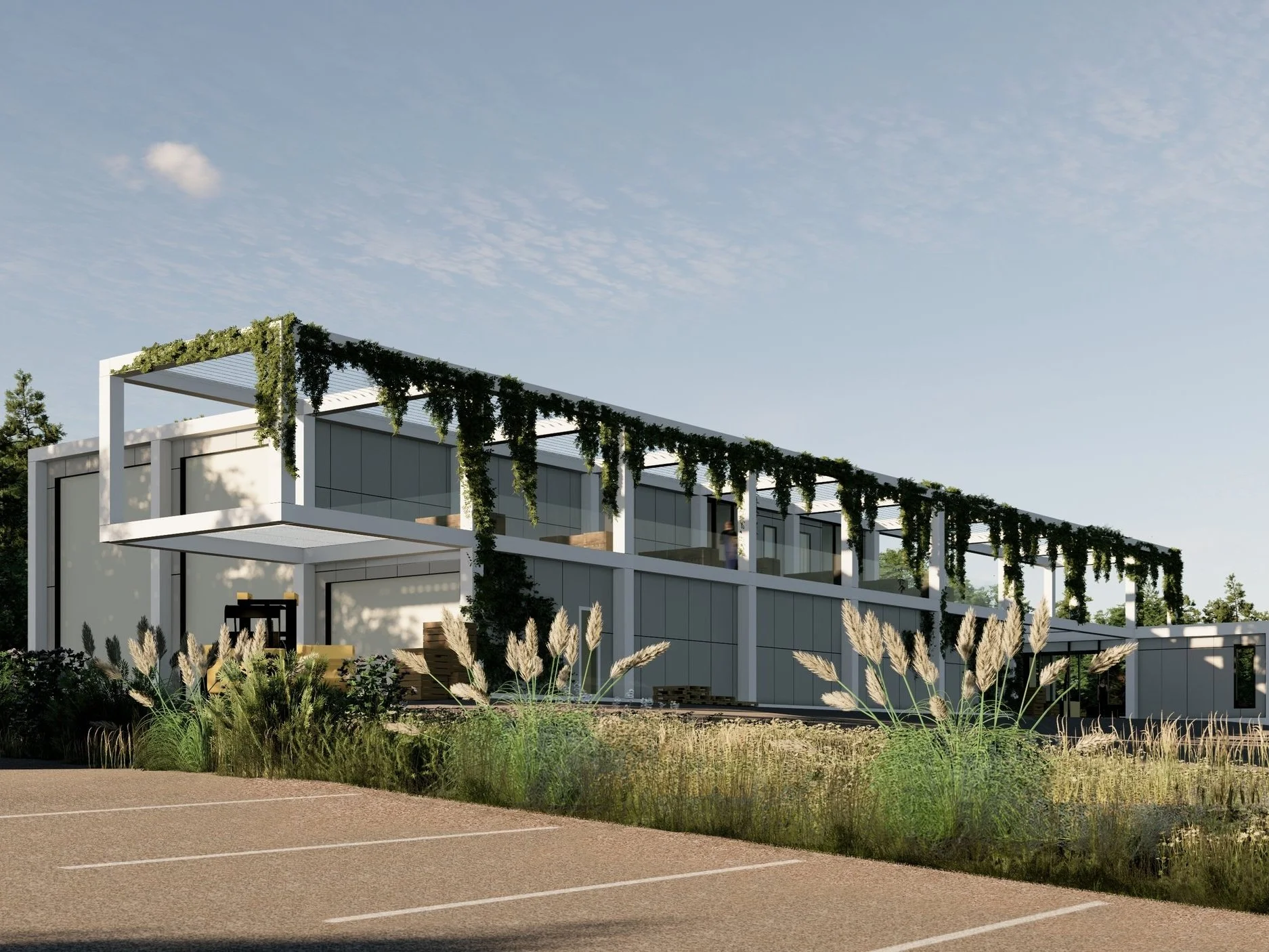 Modern building with white exterior, large glass windows, and green vines hanging from roof above landscaped area with tall grasses, in a parking lot under a partly cloudy sky.