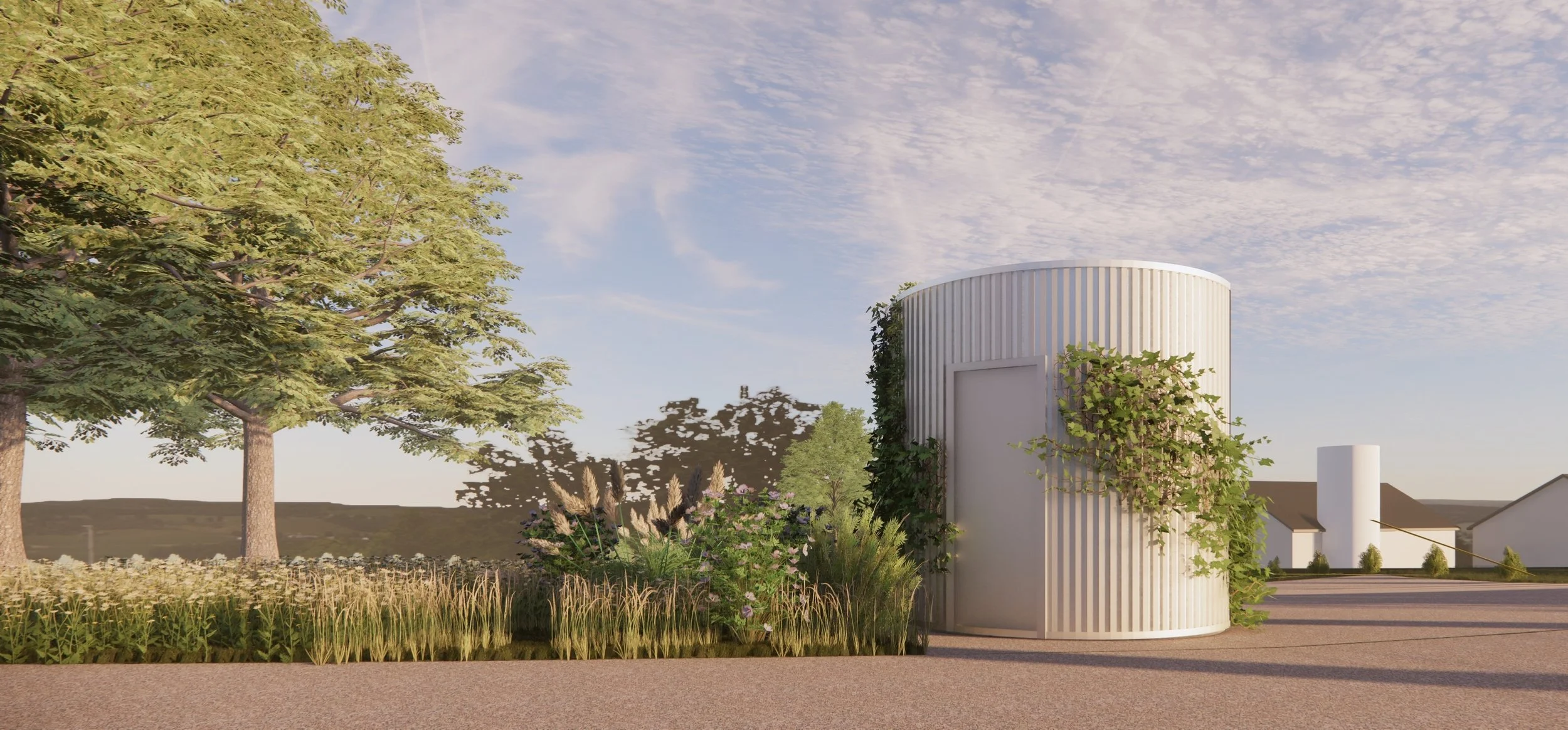 Modern cylindrical white building with vertical siding, surrounded by greenery and flowering plants, under a partly cloudy sky.