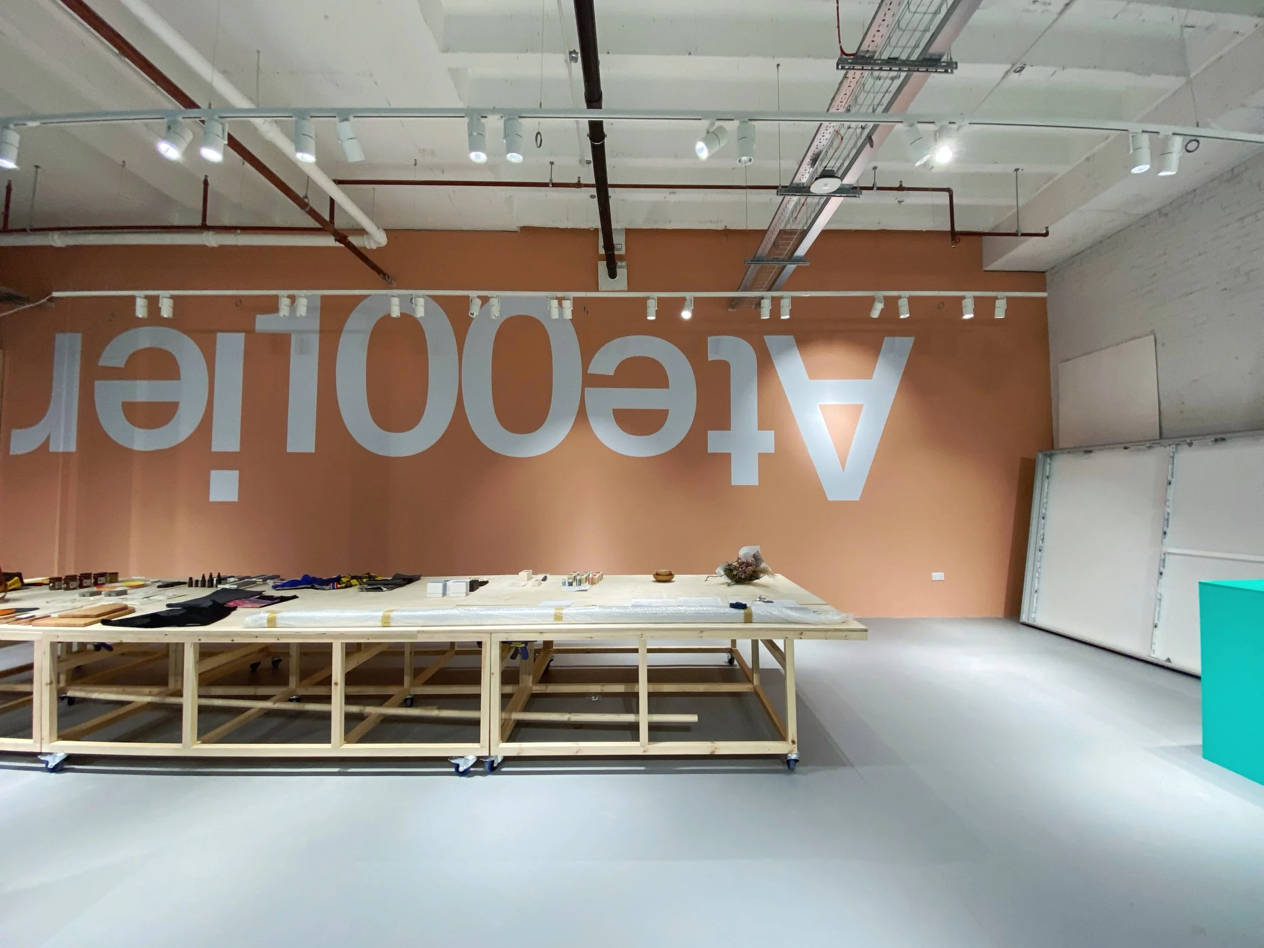 Atelier100 retail concept in London by Studio Navet — shop and workshop space fitted with repurposed store materials.