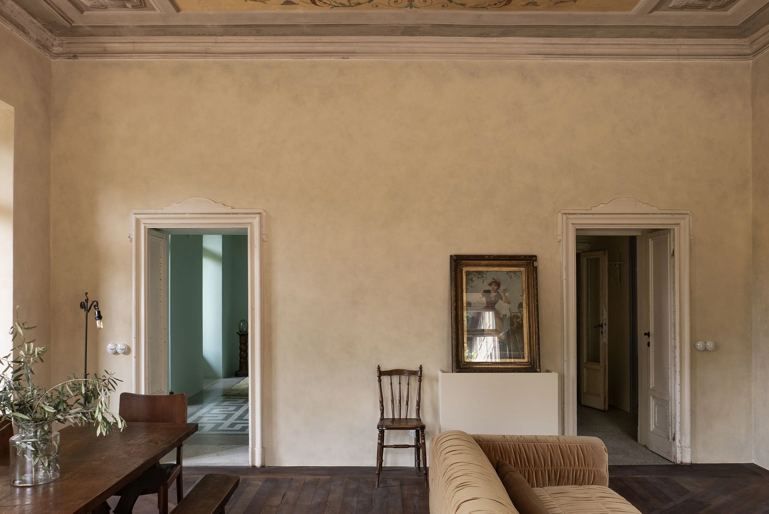 The Hideaway apartment near Lake Como by Studio Navet — frescoed ceilings and Venetian terrazzo with modern furnishings.