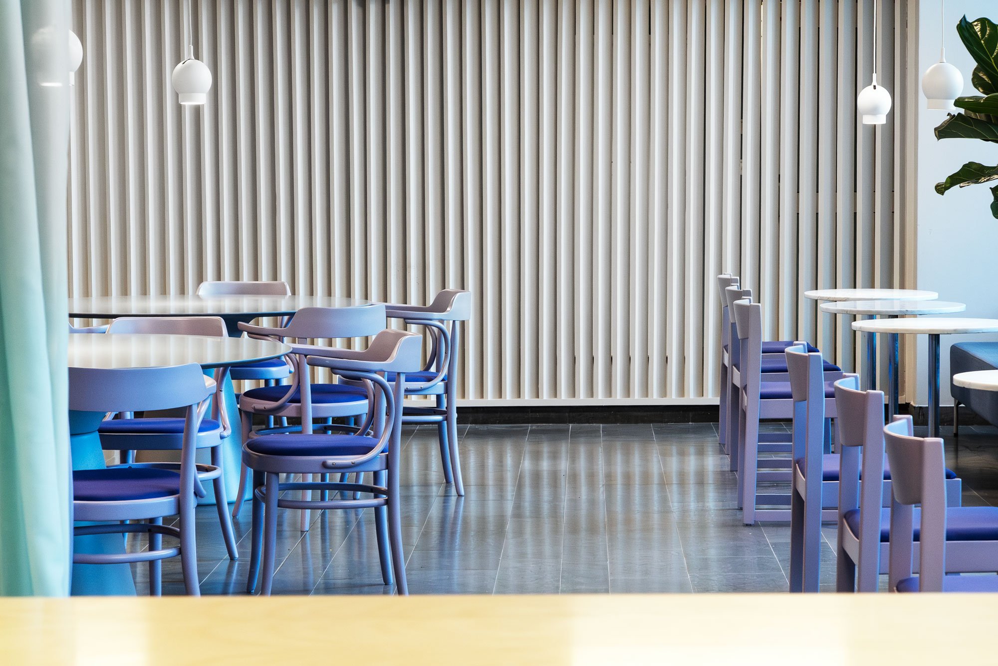 Nornan public hub in Nynäshamn — reuse-led interior by Studio Navet with recycled furniture and bold colour.