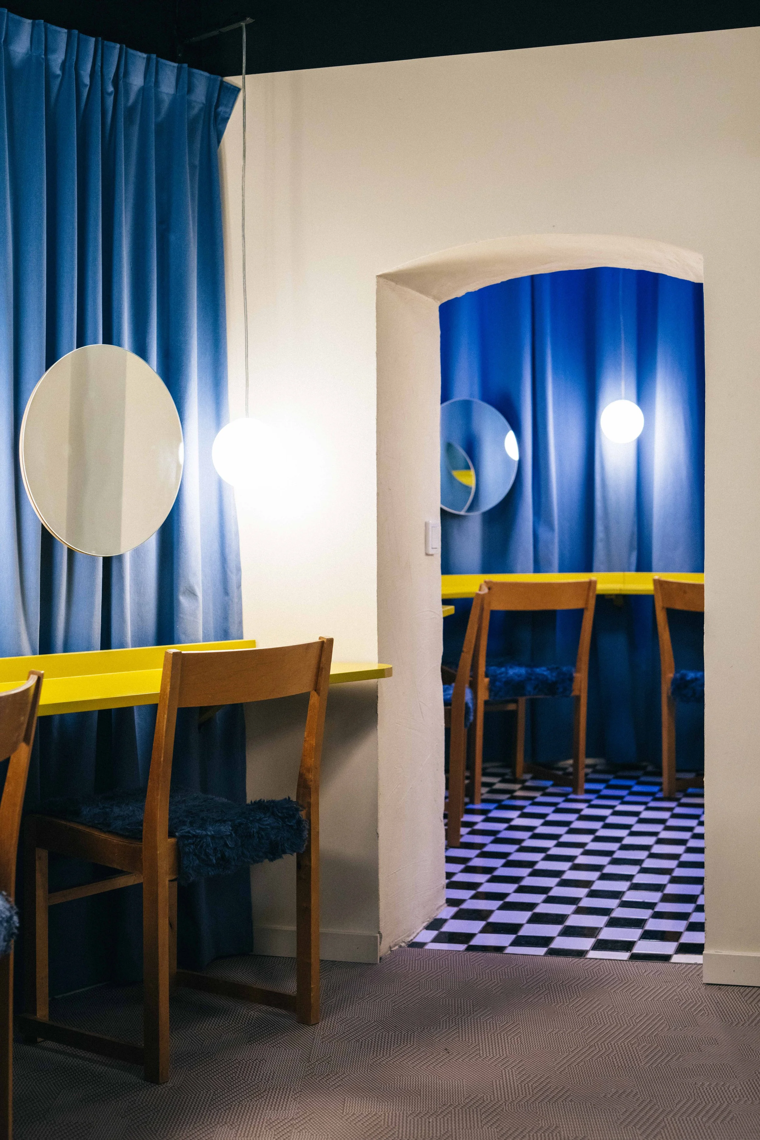 Konträr theatre in Stockholm by Studio Navet — colourful dramatic foyer leading to a black box stage.