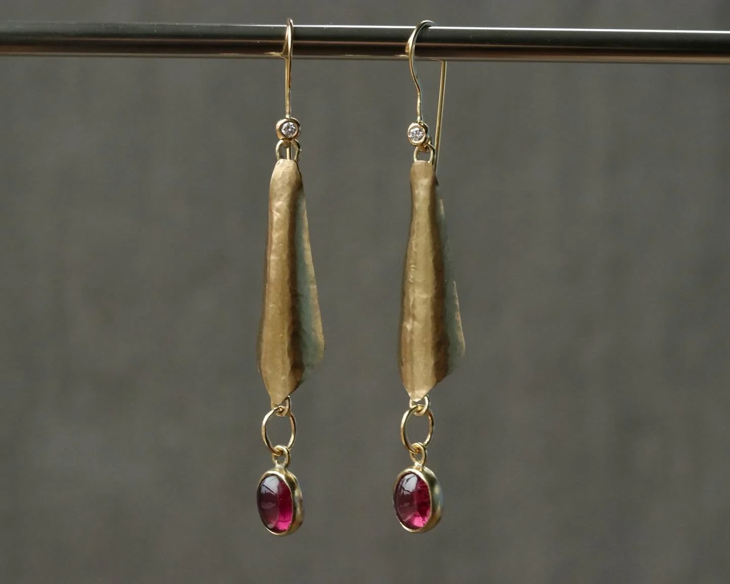 Here are a pair of ear bobbles I just finished creating! A spicy mauve set of tourmalines hang from a middle field of formed gold. The hooks have a set of antique diamonds atop to give a light pop there too. This set is made from 22 karat gold. 
.
.
