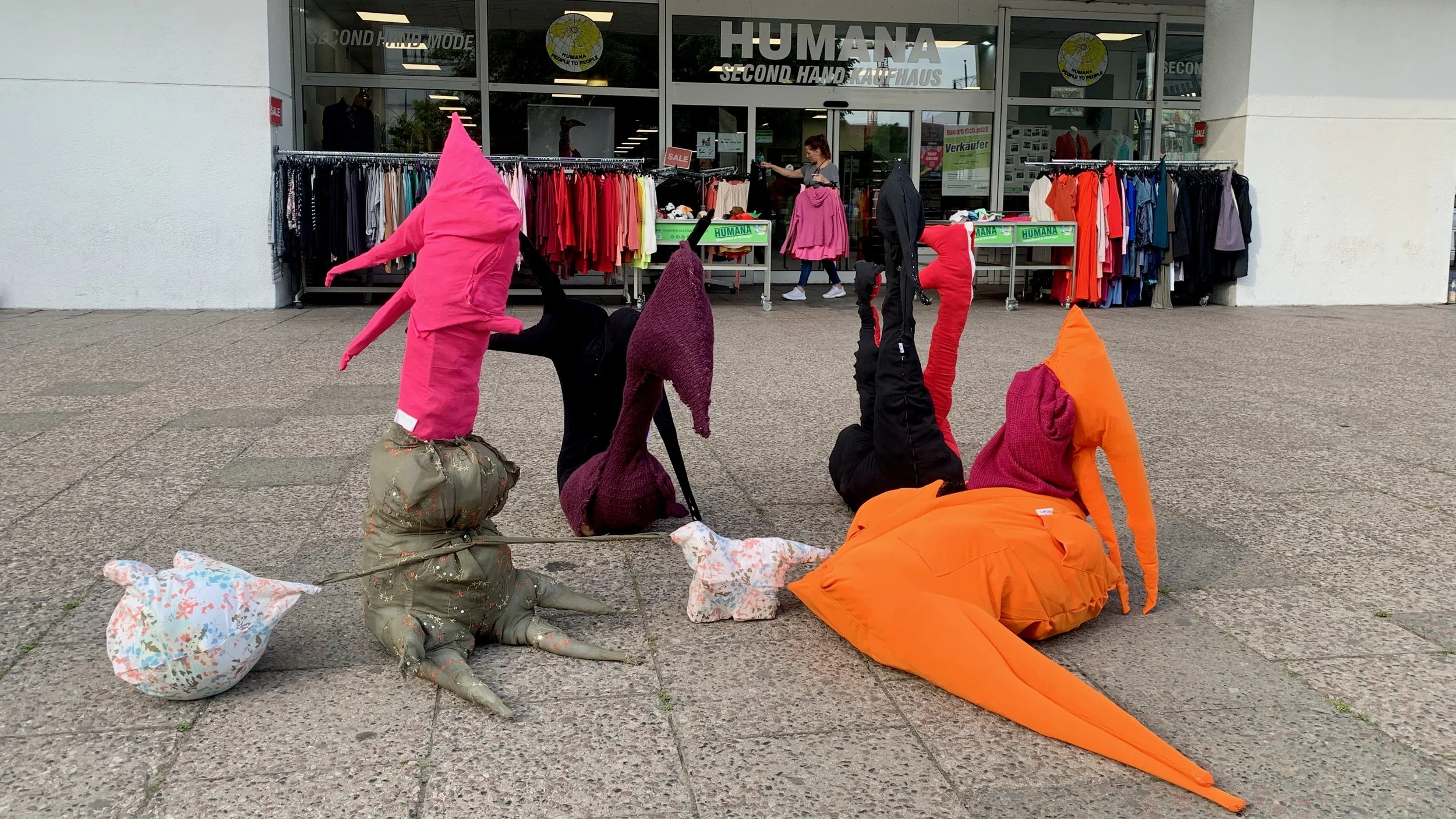 Creating a circular art economy by donating Berlin Creatures: a group of portraits made from salvaged objects to the charity shop Humana where they would be surrounded by other recycled clothing