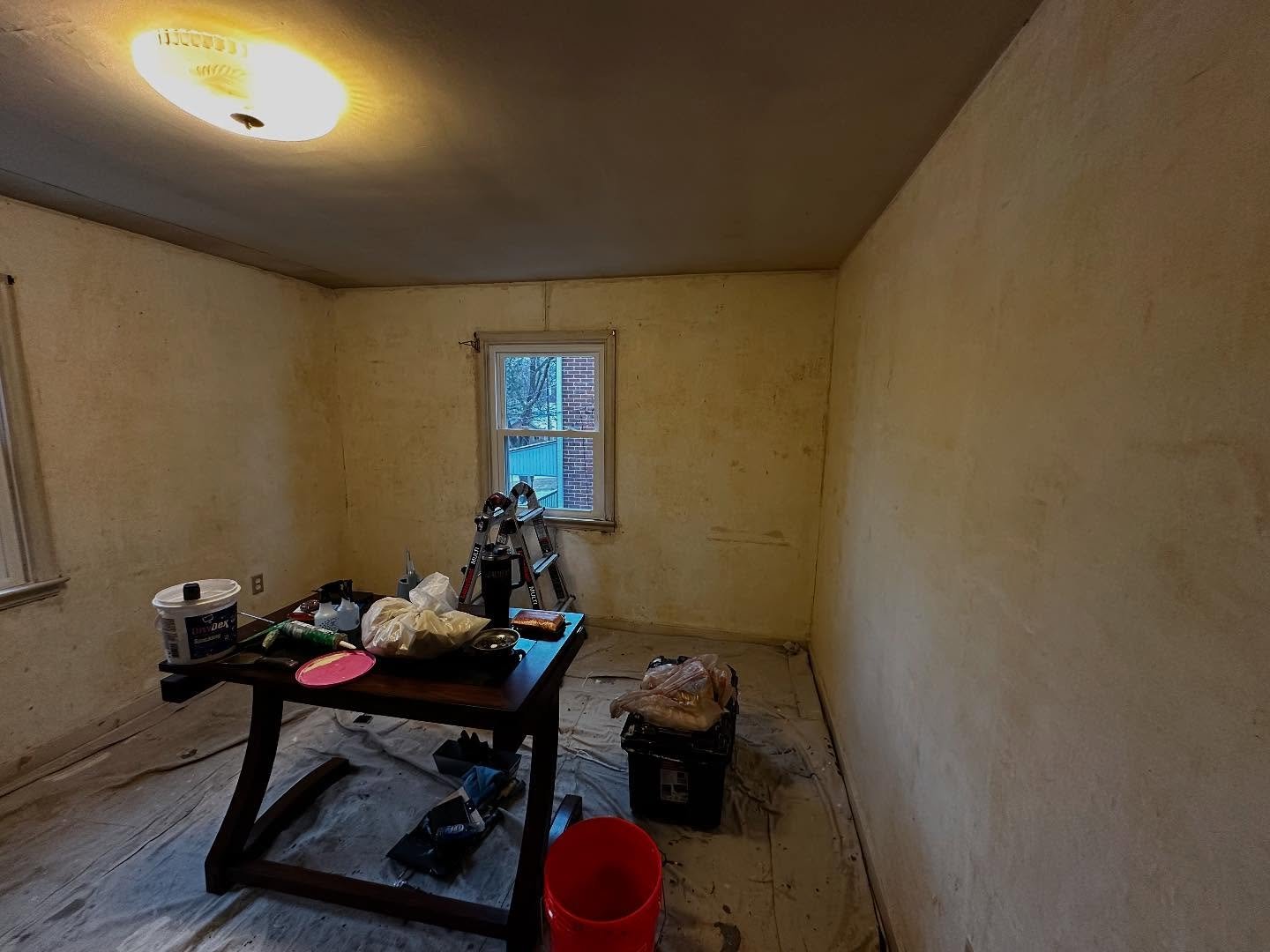 A bedroom being prepped for painting by Joseph's Coat of Colors LLC in Reading, PA
