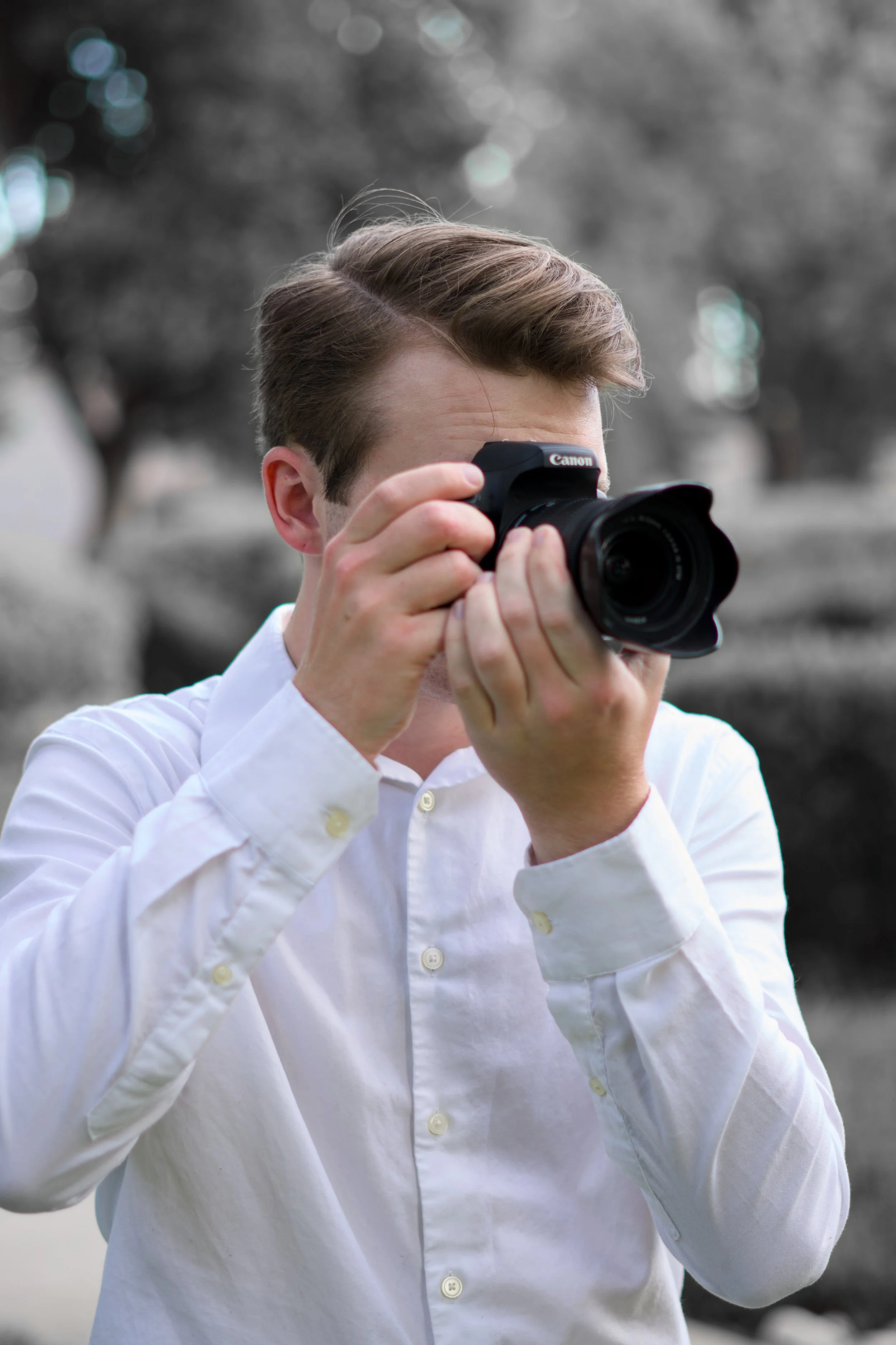 Brody Harris (Business Founder & Owner) taking a picture.