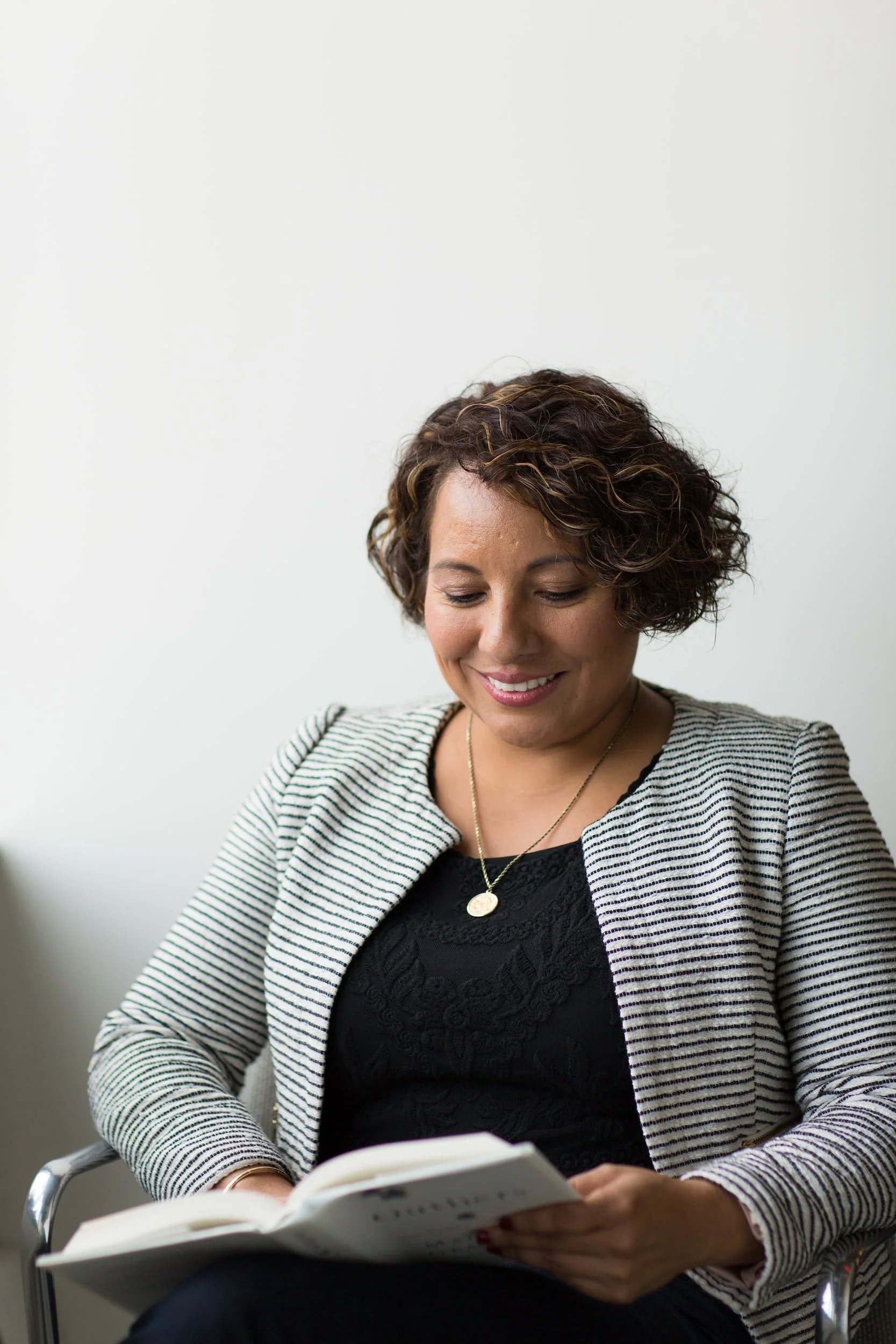 woman smiling reading book cervical screening pap smear services south west bunbury maternity health by nurture holistic clinic doctor