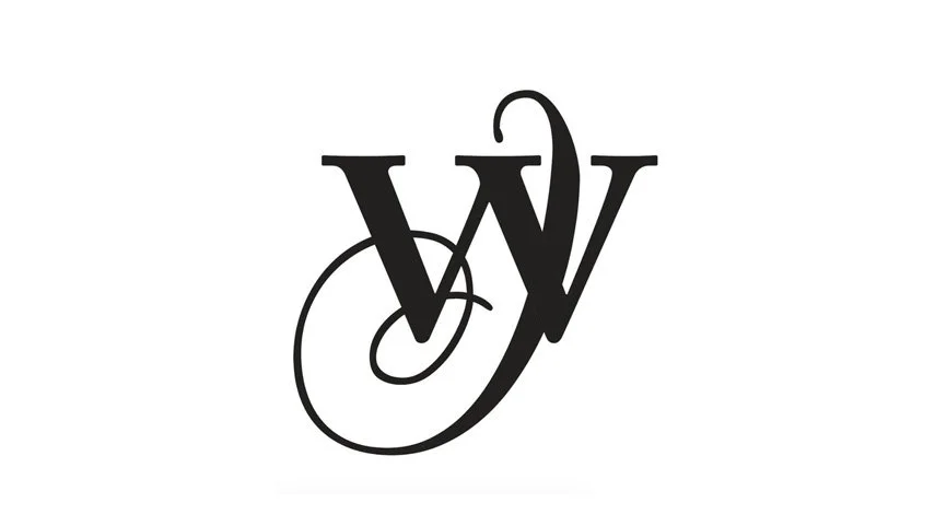 A black cursive monogram with the letters W and V intertwined on a white background.