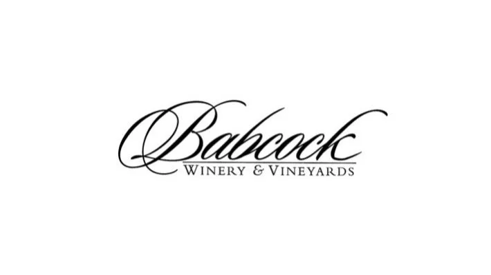 Logo for Babcock Winery & Vineyards in black cursive font on a white background.