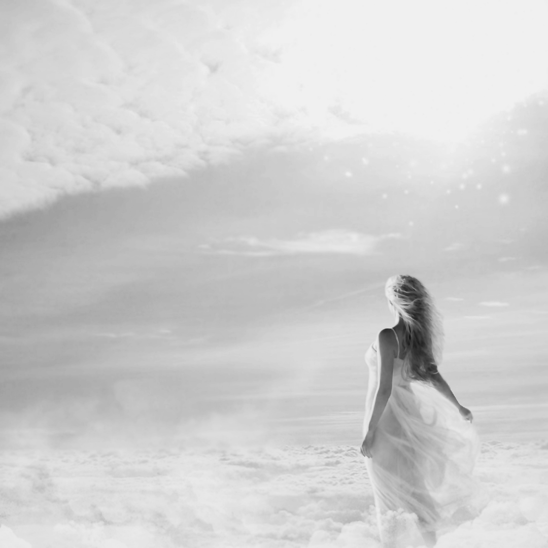 A woman in a flowing dress standing on a cloud-filled landscape with a bright sky and clouds in the background, in black and white.