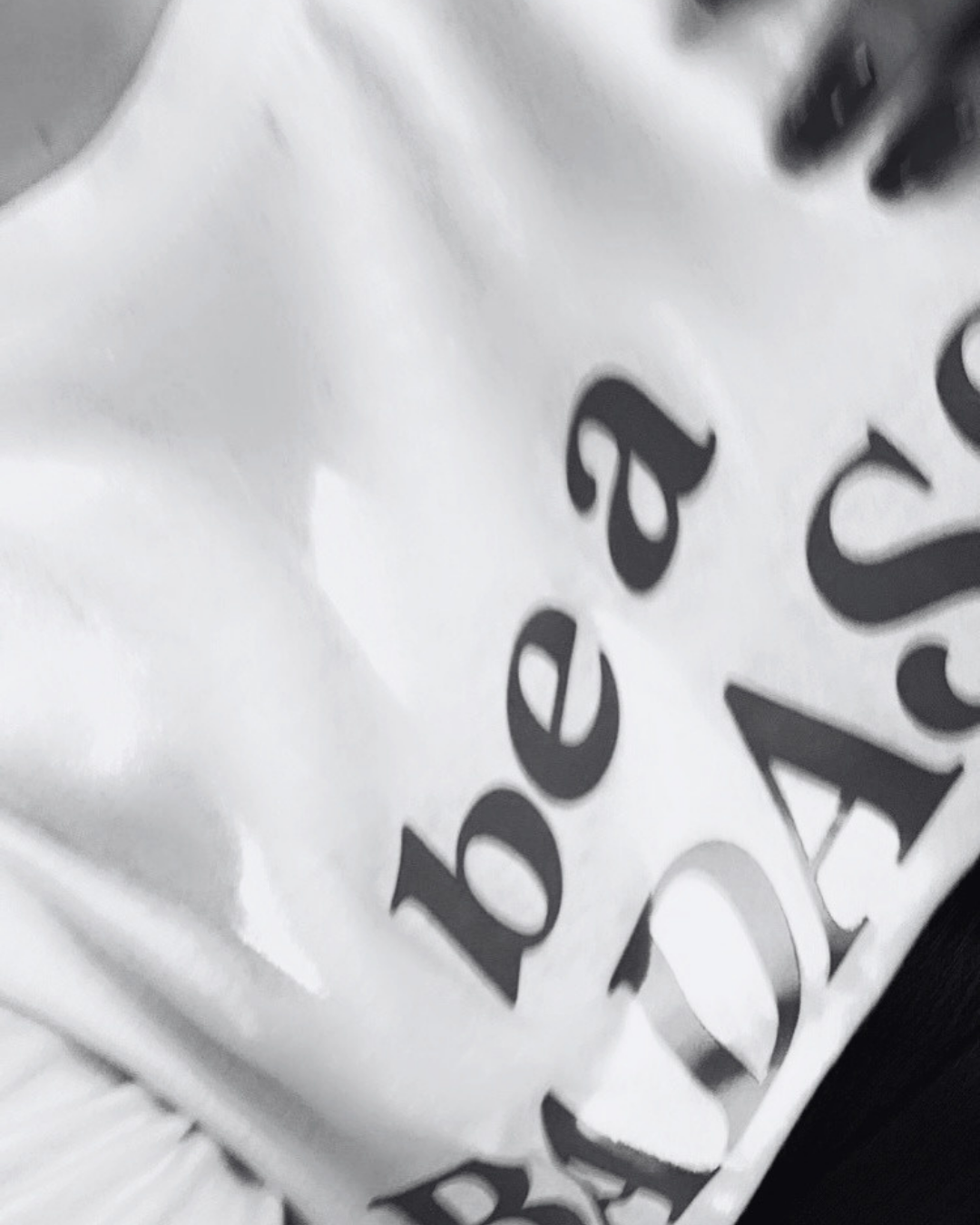 A close-up of crumpled white packaging material with black printed text.