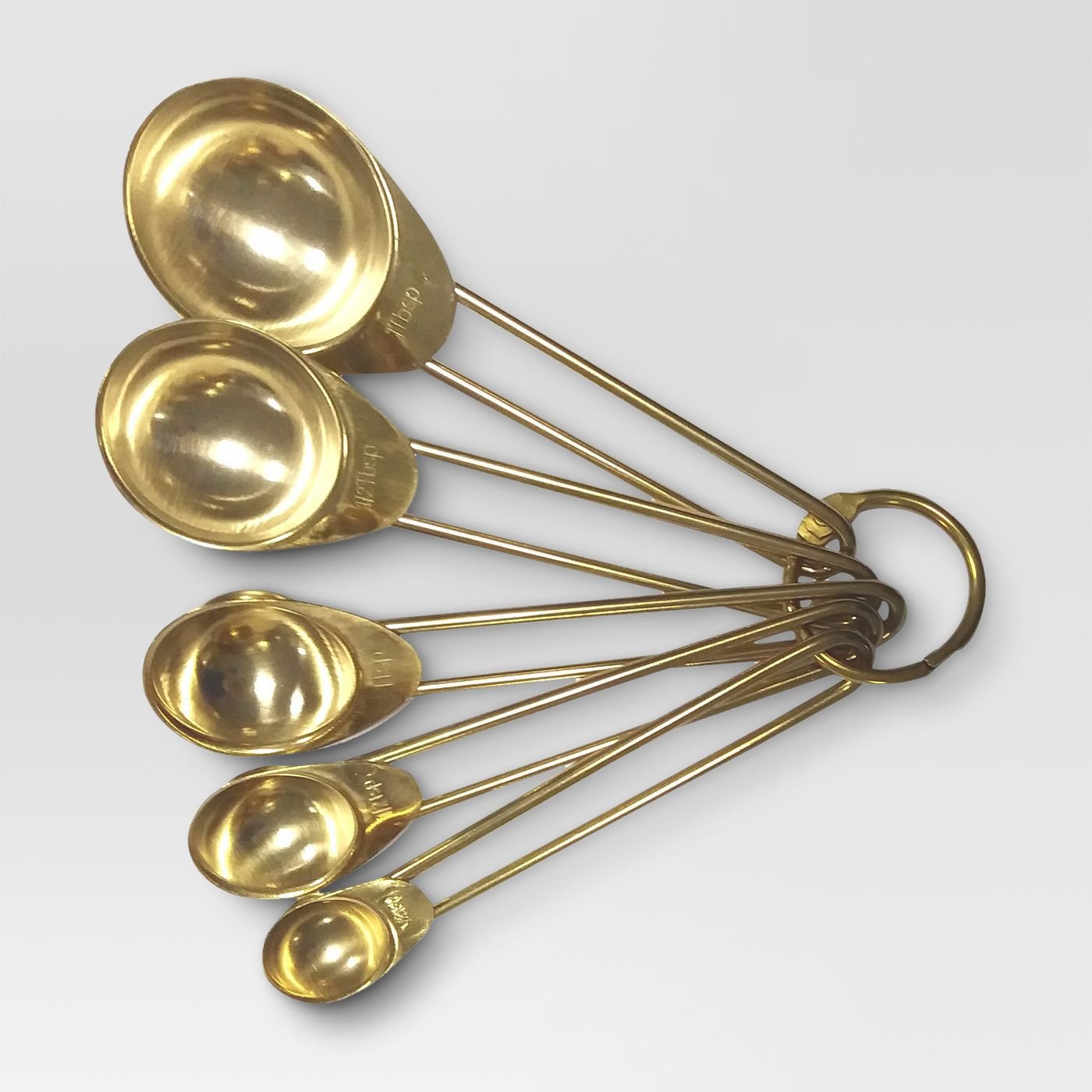 brass measuring spoons, contemporary cookware