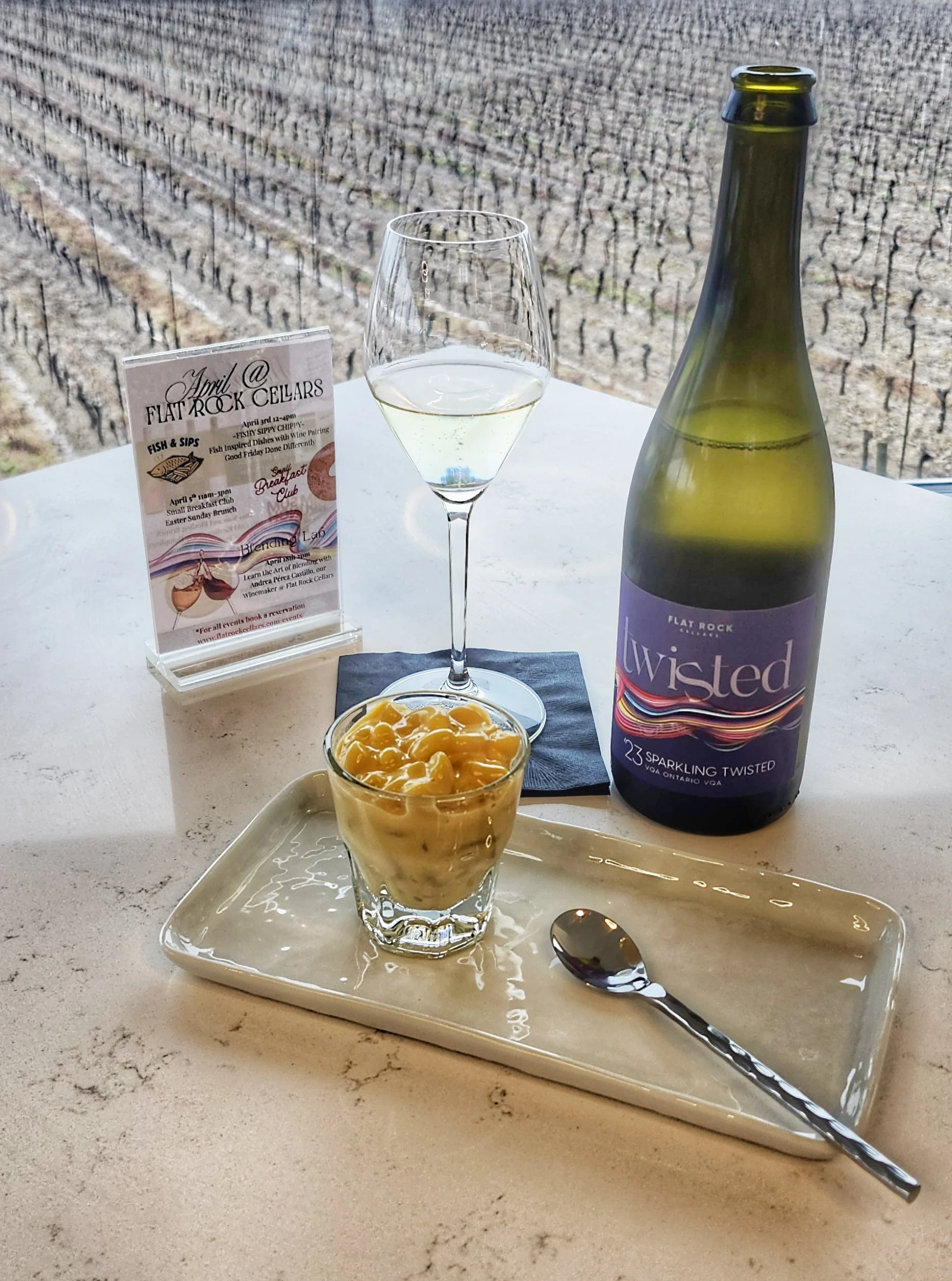 Crispy deep-fried ice cream drizzled with chocolate sauce, served with a dollop of whipped cream on a white plate.