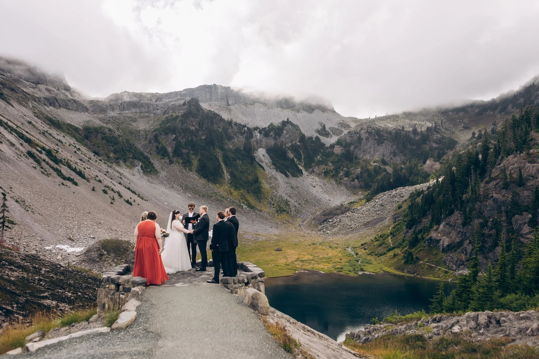 Intimate elopement ceremony at Heather Meadows along the Fire and Ice Trail with Mount Baker alpine landscape and Bagley lake below