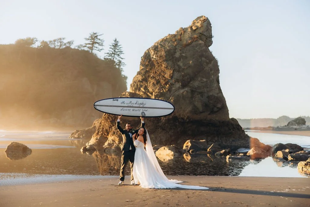 Adventure elopement at Ruby Beach, with a couple celebrating their wedding day with a surfboard on the Washington coast