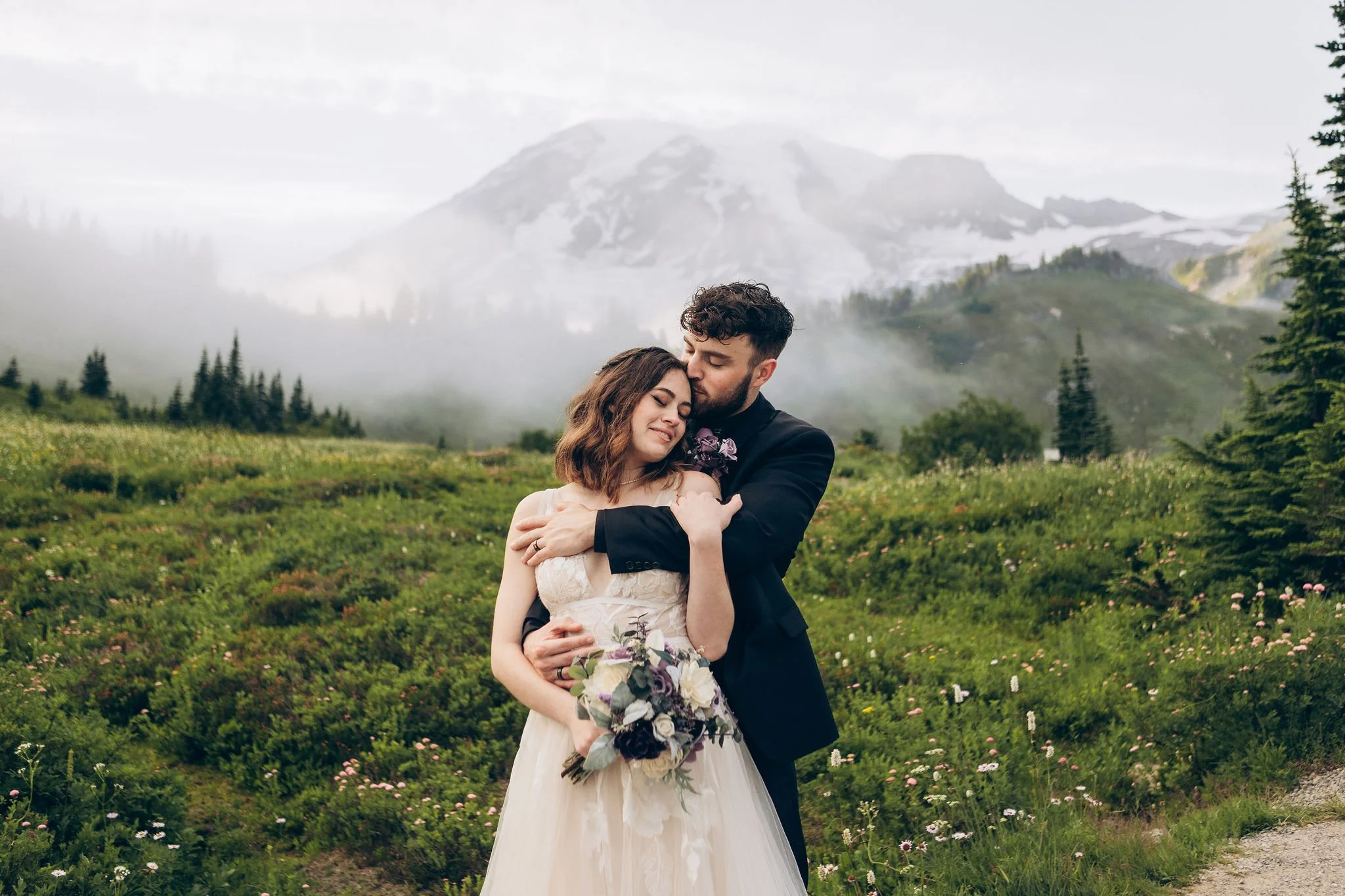 Intimate elopement in the Paradise area with Mount Rainier rising through misty alpine meadows