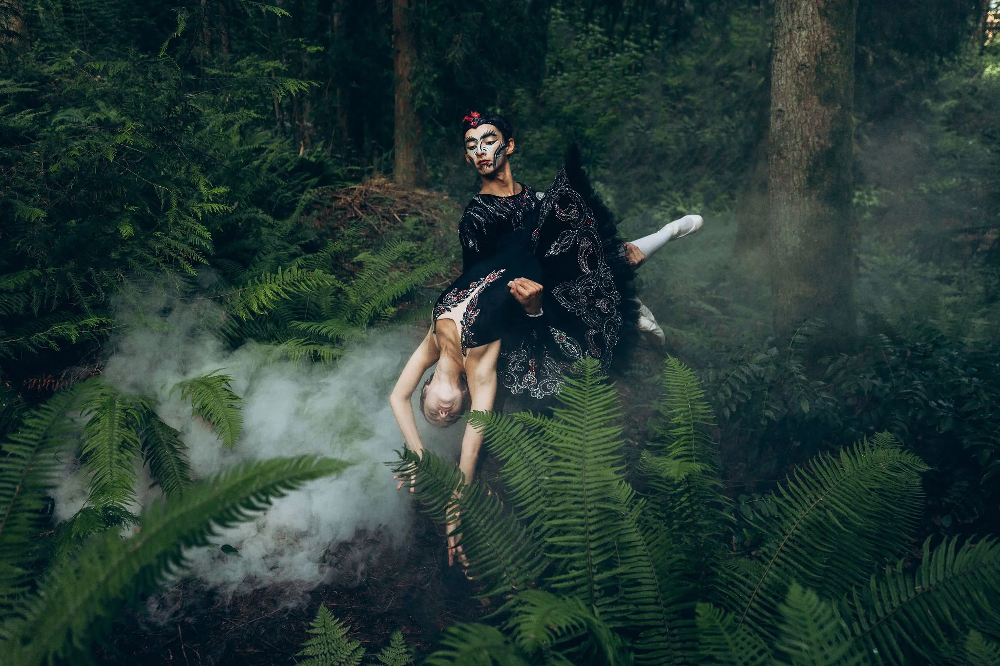 Couple wearing a dramatic themed elopement outfit in a forest, demonstrating that creative, non-traditional wedding attire can make your elopement uniquely personal