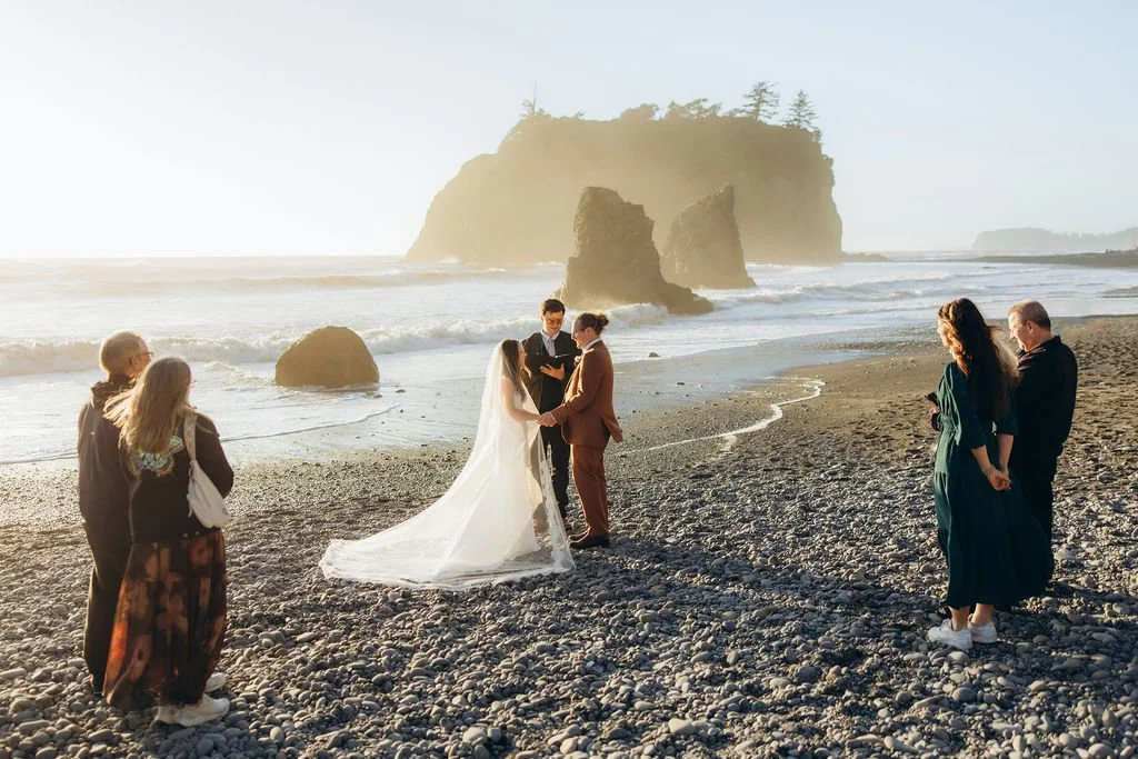 Intimate wedding ceremony with friends and family at Ruby Beach in Olympic National Park during sunset