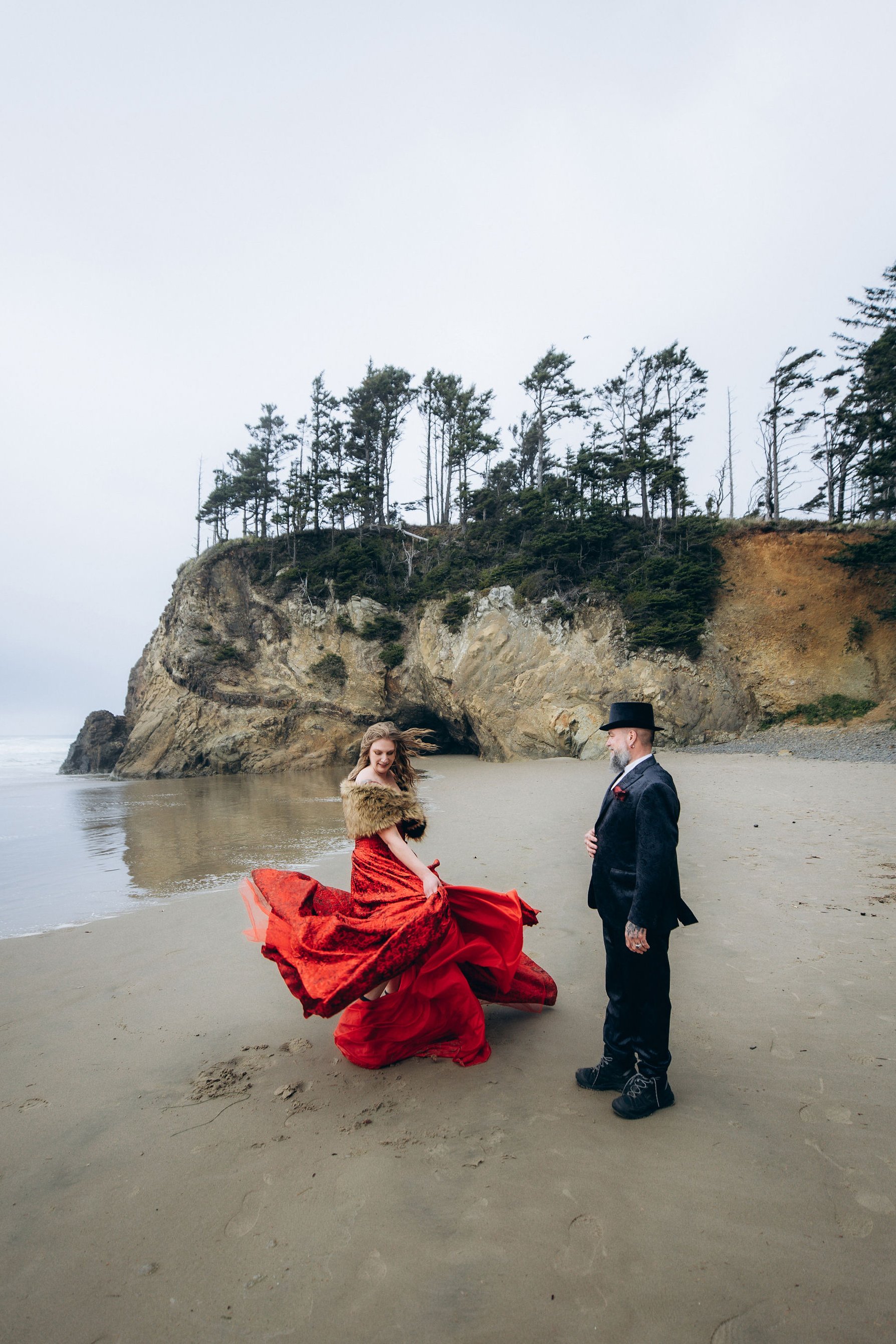 Couple at Hug Point on the Oregon Coast during a moody beach elopement