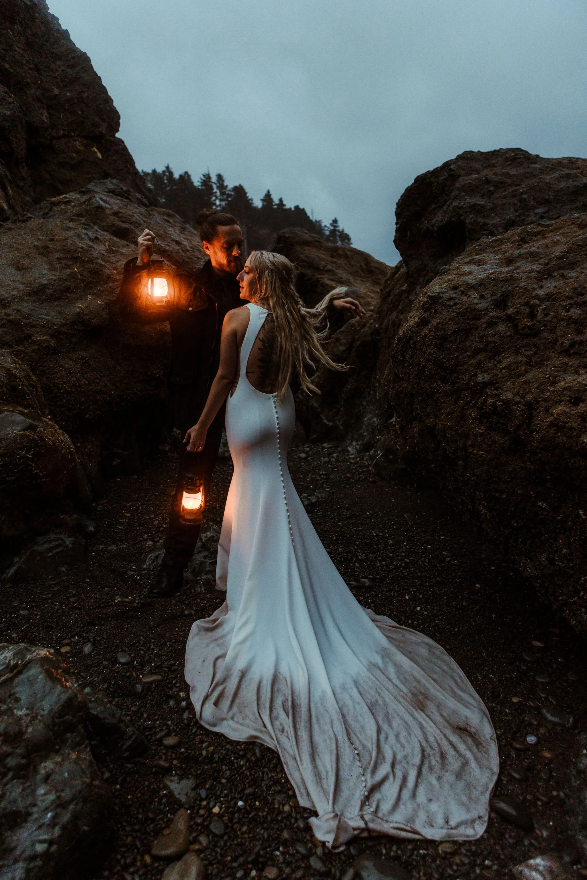 Moody elopement at Ruby Beach during blue hour with lanterns
