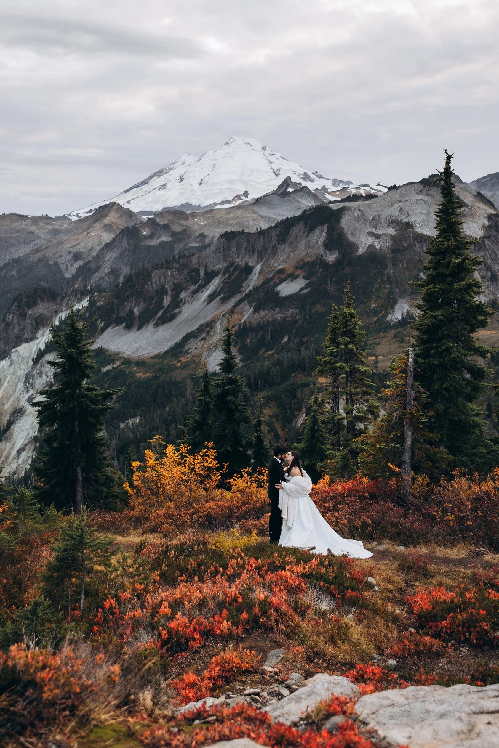 Couple celebrating their fall elopement near Mount Baker surrounded by autumn colors