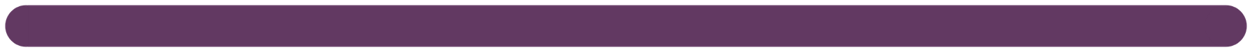 A close-up of a roll of purple ribbon or fabric.