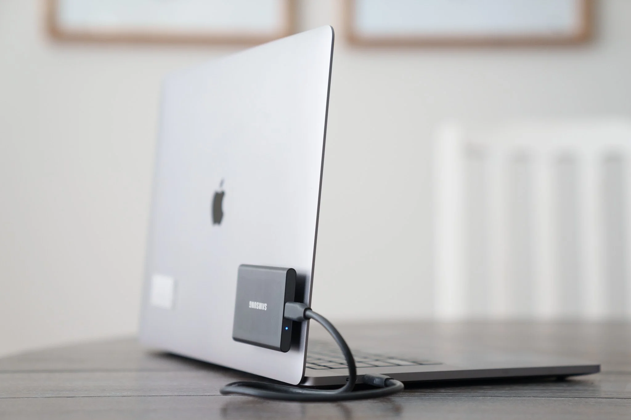 A laptop with an external hard drive attached to it