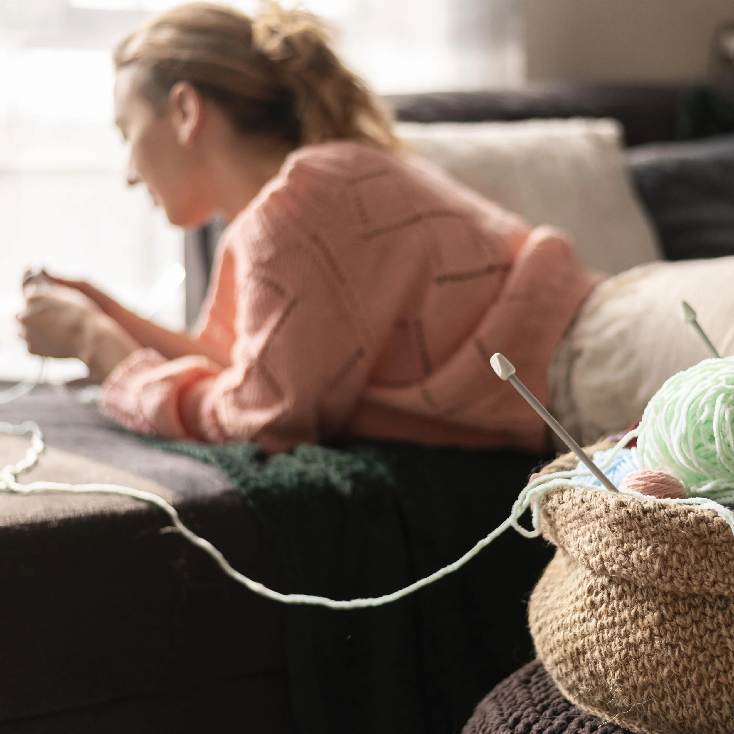 medium-shot-blurry-woman-crocheting.jpg