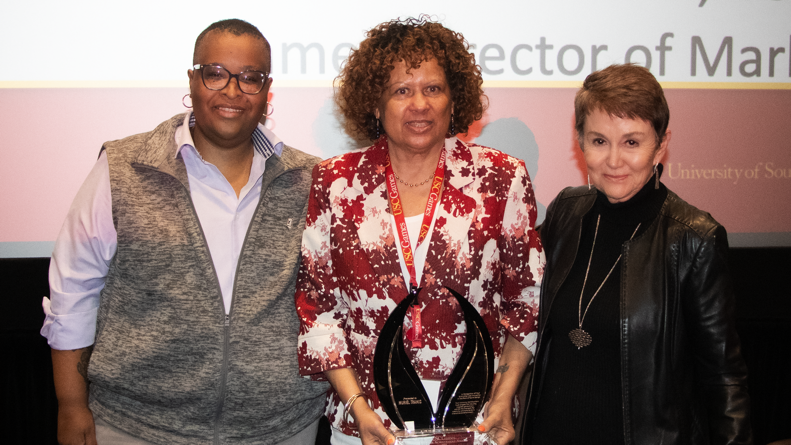 USC Games Professor Russworm (left), Muriel Tramis (center) and SCA Dean Daley (right) honor Tramis (Chevalier de la Legion d’Honneur), the first credited Black female game designer, with the inaugural Games Lifetime Achievement Award.