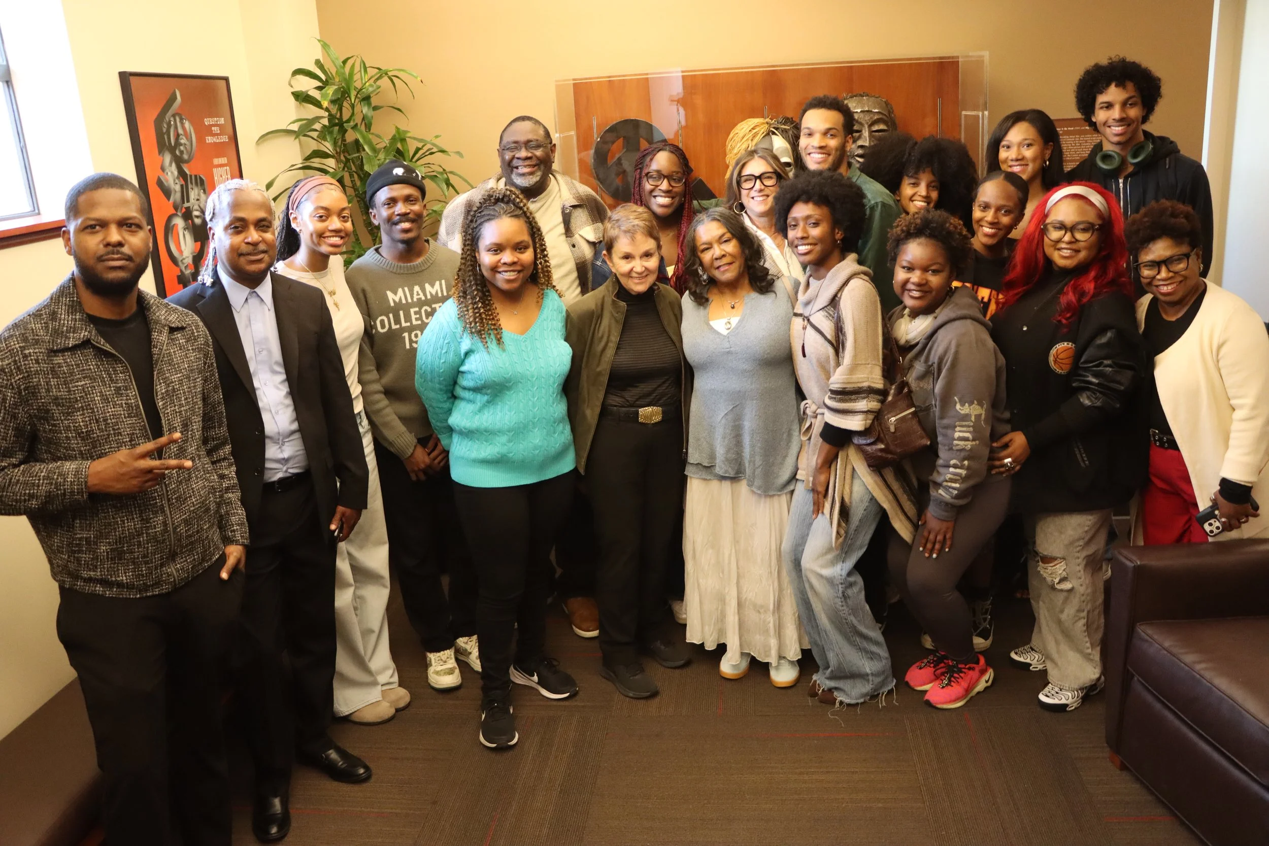 Dean Daley and Sheila Ward-Johnson, mother of John Singleton, join students at the unveiling of the John Singleton Lounge on the fourth floor of the SCA building.
