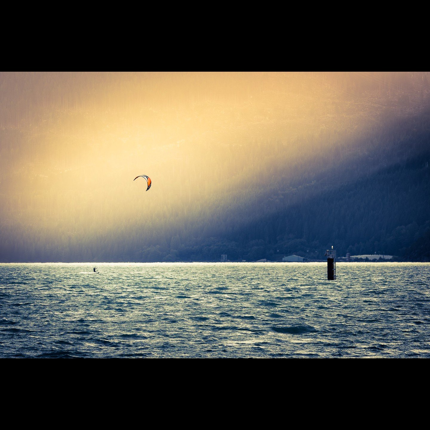 This was an #epic moment.
There was some localized fog in the background, but, as the sun slowly went down behind the mountain, it threw these incredible rays into the frame.
This was part of a commercial shoot for a #Windsurf and #Kite rental compan