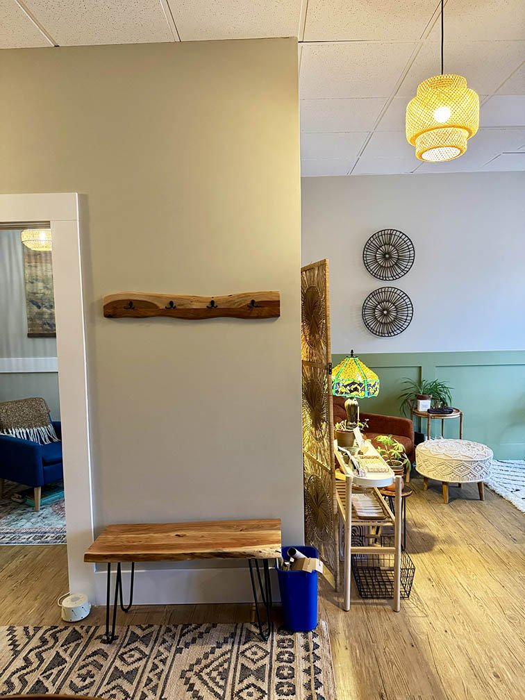 live edge coat hook and bench outside of wellness office
