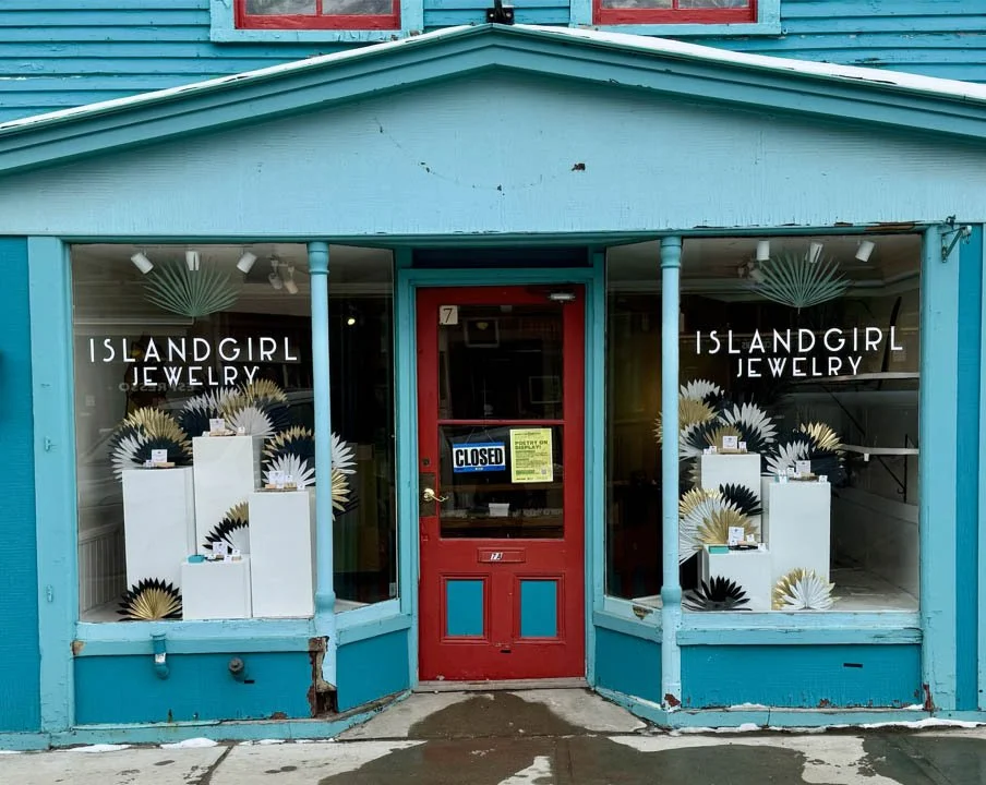 Overview of Island Girl Jewelry storefront with new palms & pedestals display