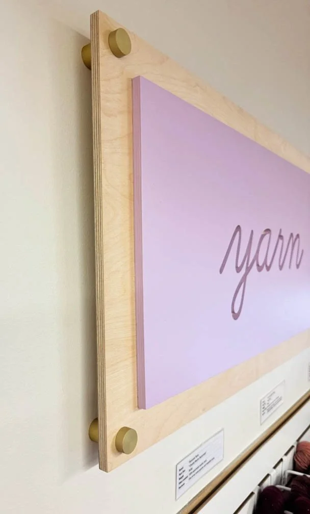 side view showcasing the detail of the gold standoff hardware