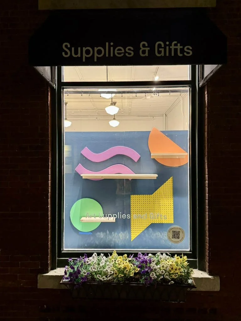 Right window display of colorful shapes and shelves, no product - June refresh 2025
