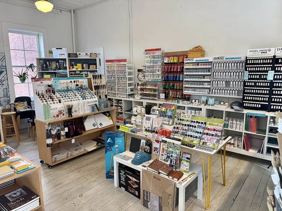 Overview of right side of art supply store showcasing paint and watercolor wall - June refresh 2025