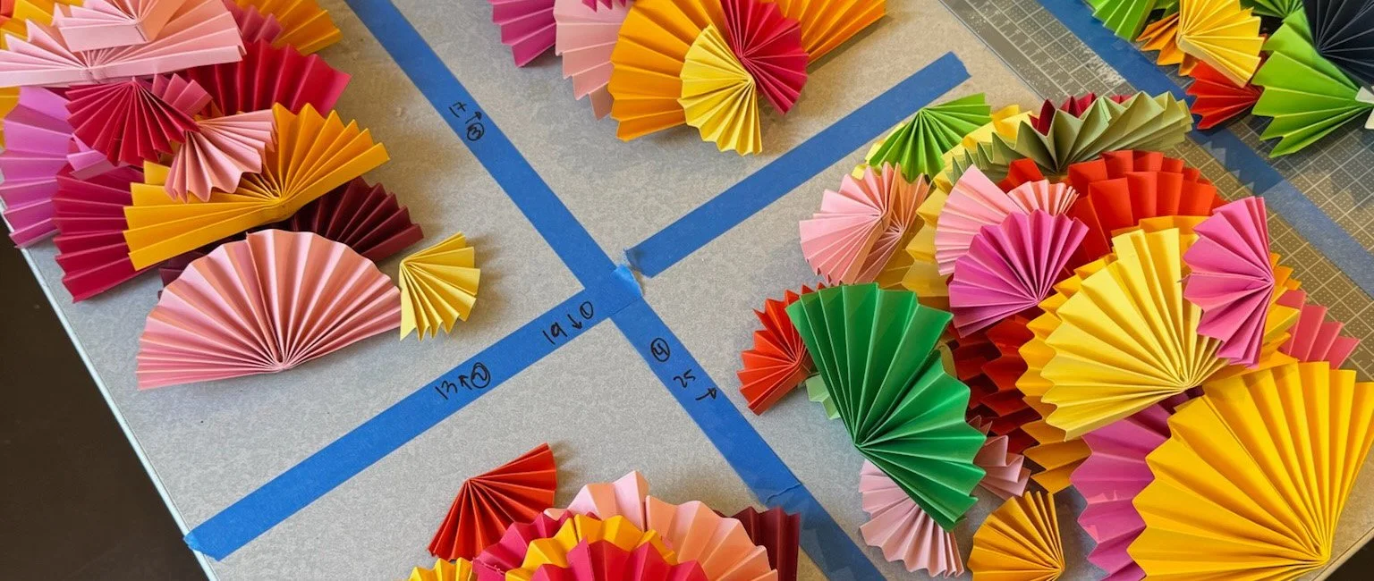 Behind the scenes studio process organizing colored fans