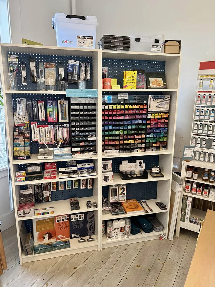 Two tall shelves merchandised with drawing supplies - June refresh 2025