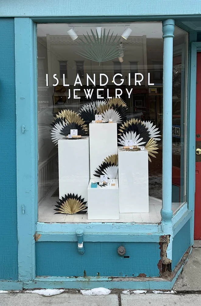 Island Girl Jewelry palms & pedestals left window display