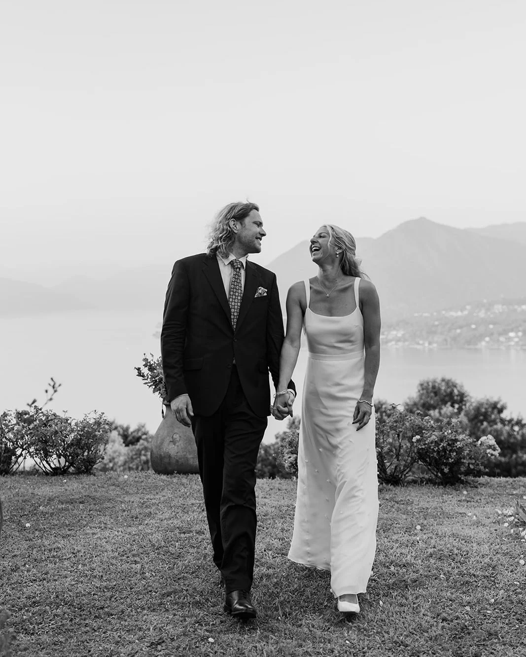 REAL BRIDE // Emily &amp; Rory

A serene moment above Lago Maggiore &mdash; Emily in a bespoke double silk crepe gown with a sheer georgette overlay, adorned with hand-cut, hand-embellished silk florals. 

Effortless, timeless, and purely her. 

Phot